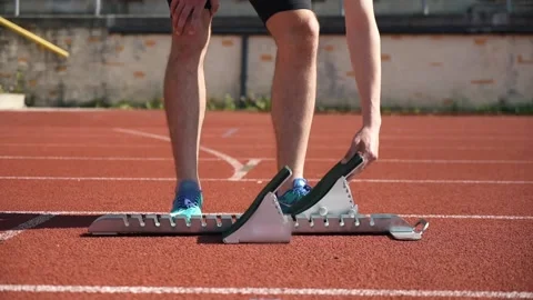 Running on a short distance, preparation for the start on the starting blocks Stock Footage 274678232