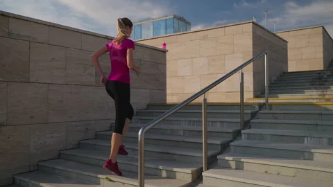 Running up the stairs as cardio workout Stock Footage 168657129