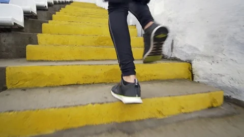 Running Stairs - man runner sprinting up staircase in HIIT run exercise. Fit 動画素材 84804514