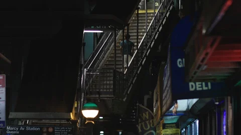 Running up steps to catch the subway Stock Footage 129711187