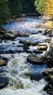 Running Stream Through Rocks and Stones Stock Photos
