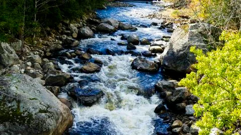 Running Stream Through Rocks and Stones Stock Photos