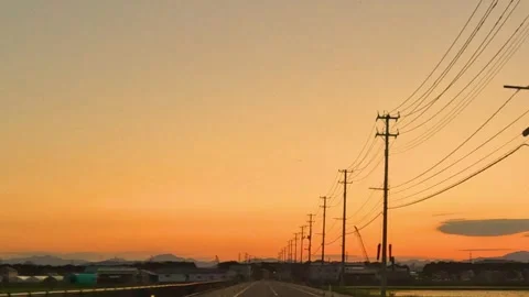 Running in the sunset and power lines Stock Footage 243471707