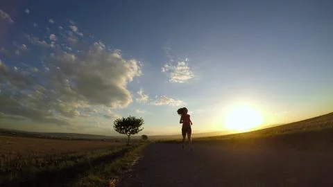 Running at sunset. Stock Photos