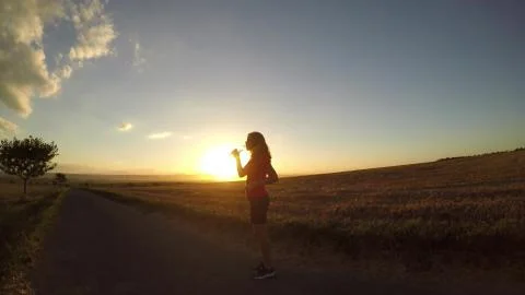Running at sunset. Stock Photos