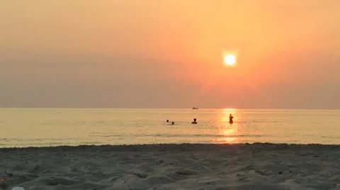 Running into the sunset in the water Stock Footage 13088919