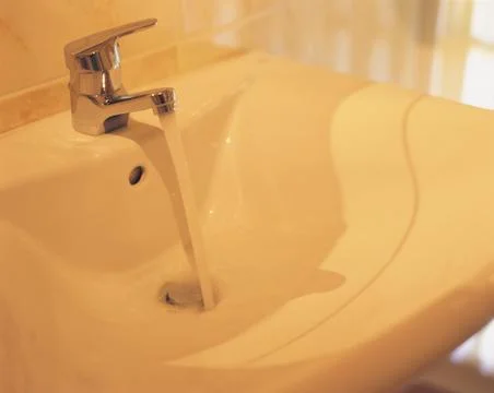 Running tap Stock Photos