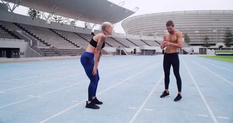 Running, teamwork or athlete with high five on track, commitment or fitness 動画素材 256966920