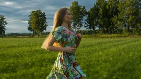 Running Through the Green Meadows Video stock 67460624