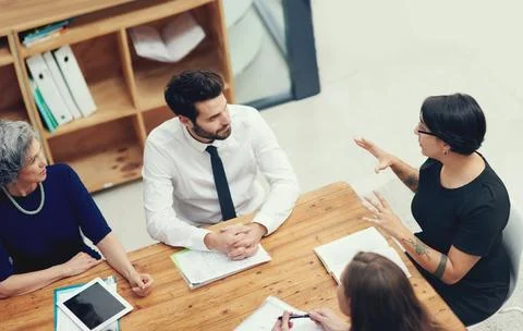 Running through some important pointers. High angle shot of a group of Stock Photos