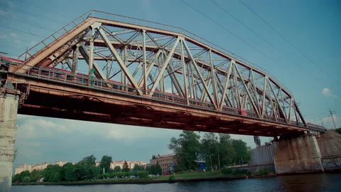 Running train on the railway bridge over the river Stock Footage 157282977