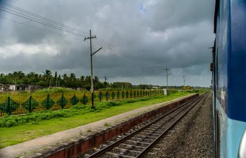 Running train side view with railway track looking awesome Stock Photos