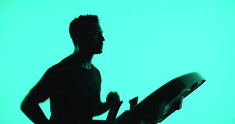 Running, treadmill and man with exercise, energy and cardio workout on studio Vidéo 331066931