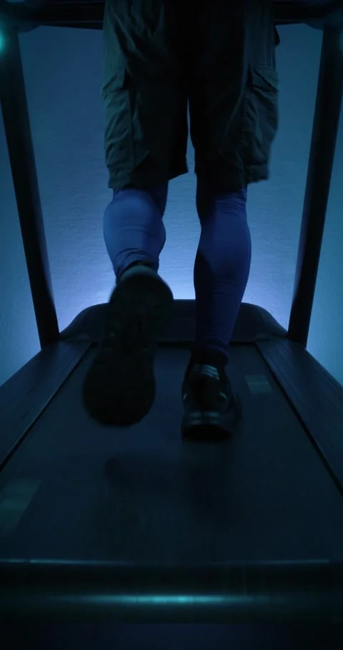 Running on a treadmill. Vertical video Stock Footage 314502294