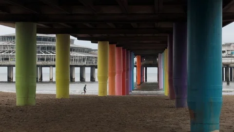 Running under the Pier in Scheveningen Stock Footage 118827790
