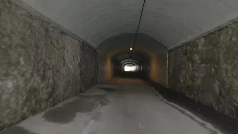 Running walking through dark tunnel at night, danger, escape Stock Footage 281401678