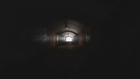 Running walking through dark tunnel at night, danger, escape Stock Footage 281401742