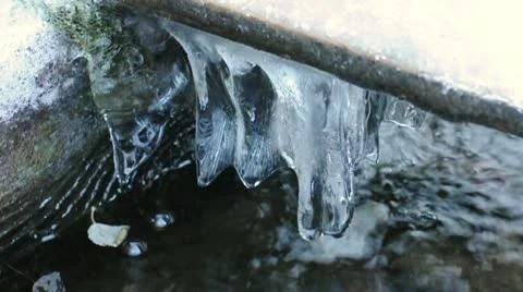 Running water and ice Stock Footage 10304002