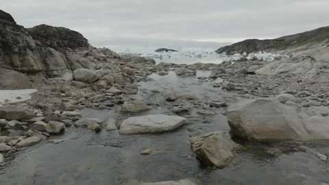 Running Water and Ocean Background Near Ilulissat Aerial Stock Footage 292941382