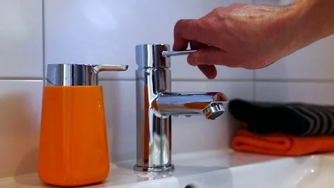 Running water in bathroom Stock Footage 78873316