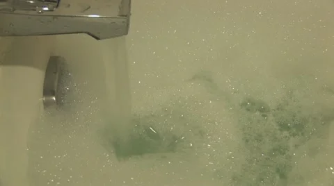 Running water into a bathtub Stock Footage 11814941