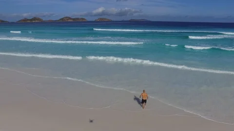 Running into the water from a drone 스톡 동영상 87106097