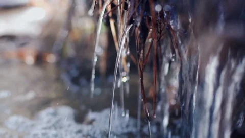 Running water in a stream of melted snow Stock Footage