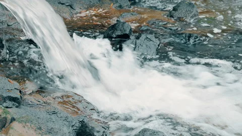 Running of water stream from waterfall on rocks and stones Stock Footage 89989178