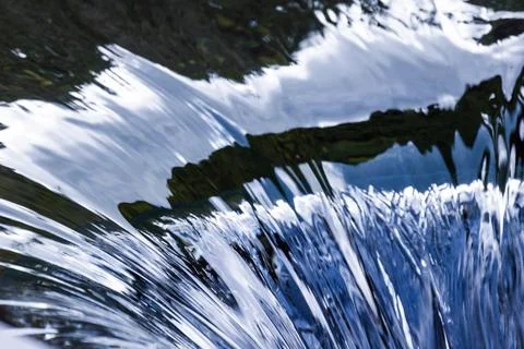 Running water surface with abstract reflections pattern. Natural background Stock Photos