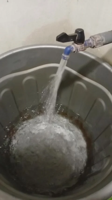 Running Water from Tap Filling Plastic Bucket Stock Footage 324604149