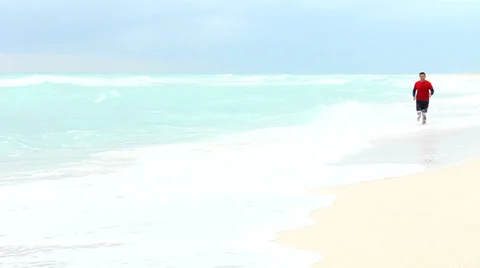 Running in the Waves Stock Footage 33577895