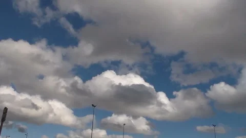 Running white clouds in blue sky background. Accelerated video. Timelapse. Stock Footage 92569117
