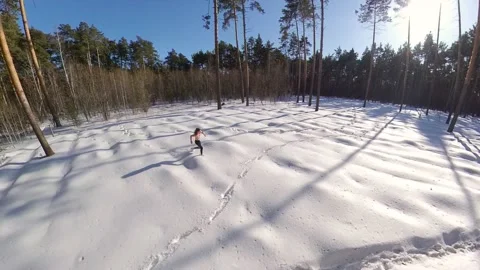 Running in the winter forest. Stock Footage 150801120