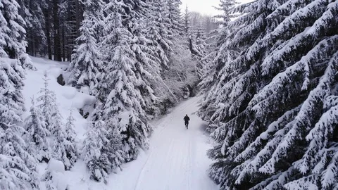 Running In The Winter Mountain Drone View Stock Footage 105468751
