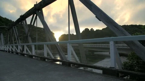 Running woman along bridge at sunset Stock Footage 59141039