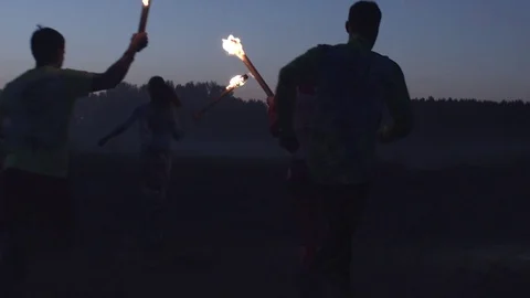 Running in the woods with a torch in hand Stock Footage 81548447