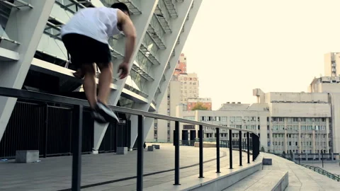 Running young man doing parkour tricks Video stock 95395446