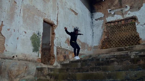 Running young man doing parkour tricks Stock Footage 117722653