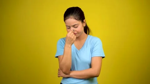 Runny nose or sinusitis concept. young woman suffers from sinus Video stock 220935931