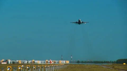 Runway with an airplane taking off Stock Footage 92207272