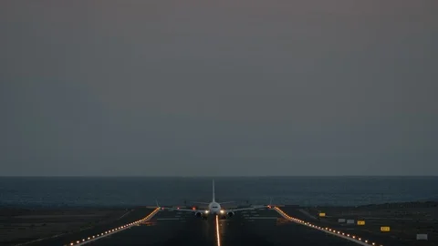A runway with a taking off plane Stock Footage 115085748