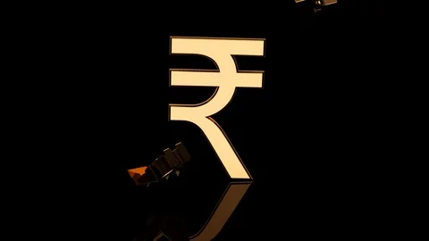 Rupee Simbol Falling On Reflective Surface Stock Footage 125702232