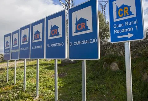 Rural accomodation sign posts placed at village entrance Stock Photos