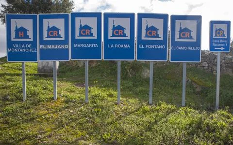Rural accomodation sign posts placed at village entrance Stock Photos