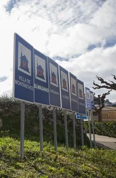 Rural accomodation sign posts placed at village entrance Stock Photos
