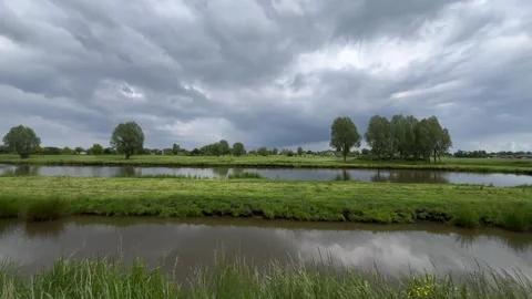 Rural Amsterdam, Low-angle rural riverscape with reflective canals and Stock-Footage 342752830