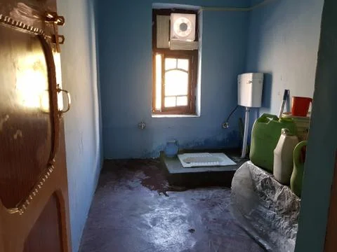 A rural area bathroom and commode Stock Photos