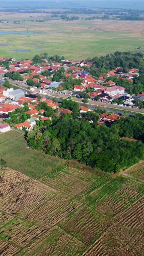 A rural area with a small town in the middle Stock Footage 319027097