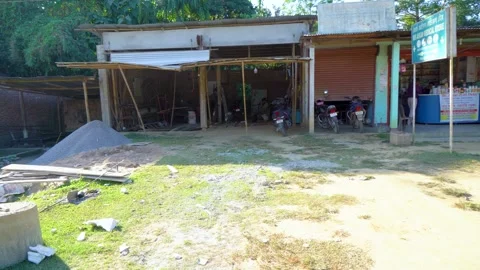Rural Assam Construction Site with Workers and Metal Frame Structure Stock Footage 341459123