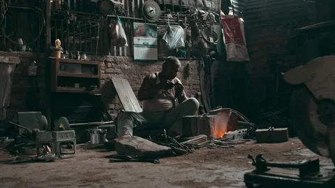 Rural blacksmith working in old traditional workshop Stock Footage 143610859